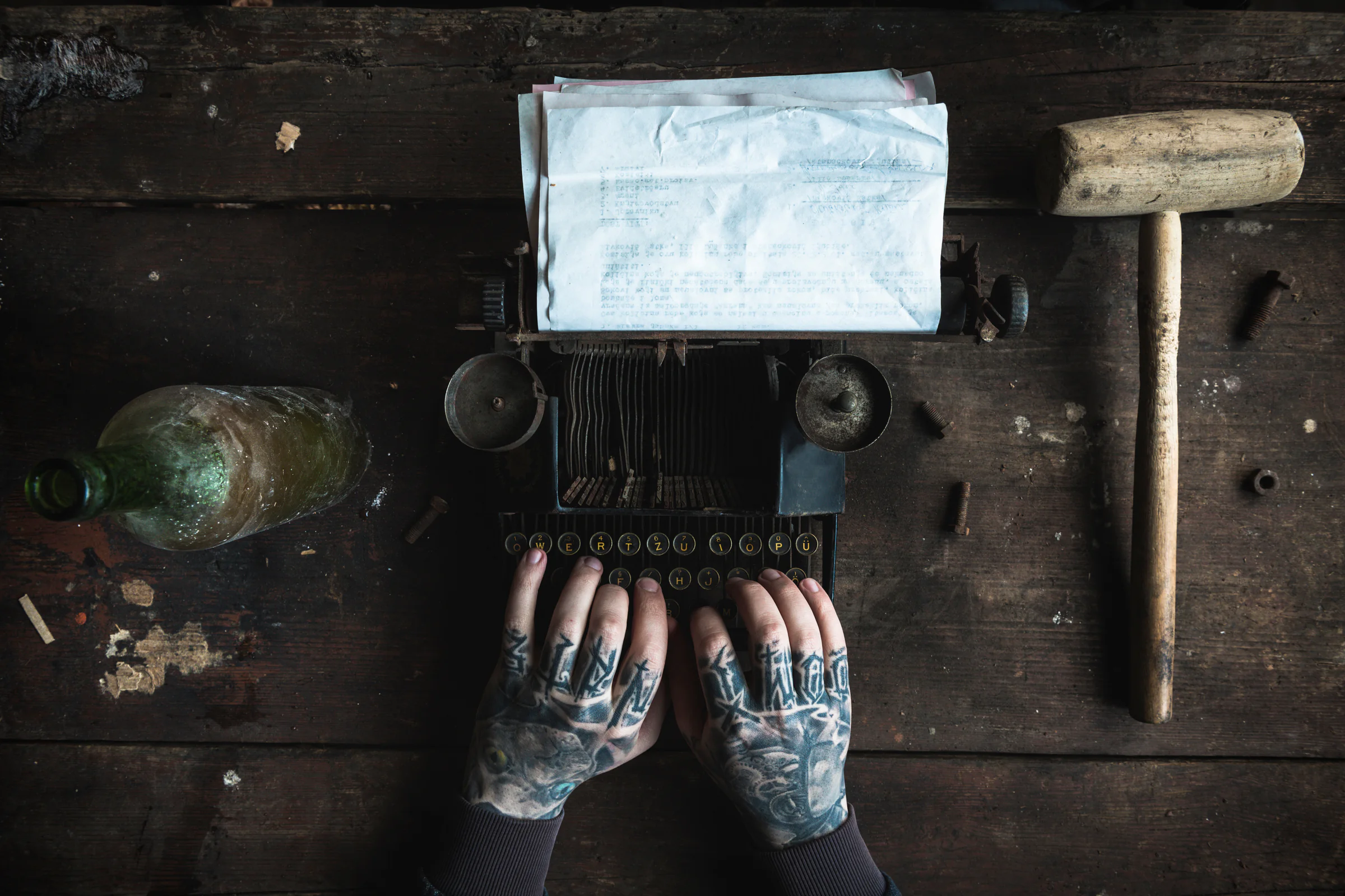 Hands working at an industrial typewriter